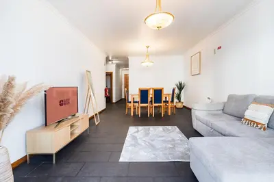 a bedroom with a bed with two towels on it at GuestReady - Charming Apartment with Ocean Views in Caniço