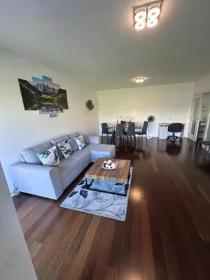 a living room with a couch and a table at Heart of Madeira SEASIDE in Funchal