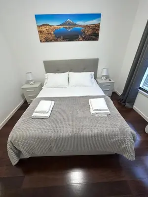 a bedroom with a bed with two towels on it at Heart of Madeira SEASIDE in Funchal