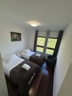 a hotel room with two beds and a window at Heart of Madeira SEASIDE in Funchal