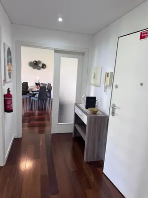 a room with a desk and a dining room at Heart of Madeira SEASIDE in Funchal