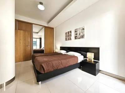 a bedroom with a large bed in a room at Anadia Atrium in Funchal