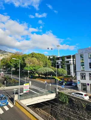 a bridge over a street in a city at Anadia Atrium in Funchal