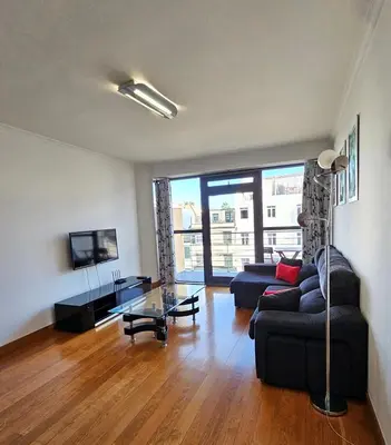 a living room with a couch and a table at Anadia Atrium in Funchal