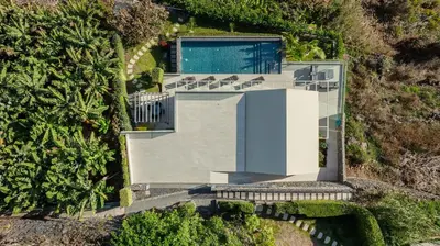an aerial view of a house with a swimming pool at Villa CLIFF HEAVEN HOUSE in Calheta