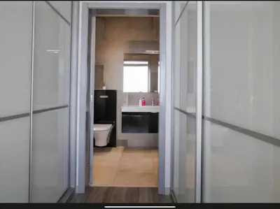 a bathroom with a toilet and a sink at Villa Rubydom by Turin in Arco da Calheta