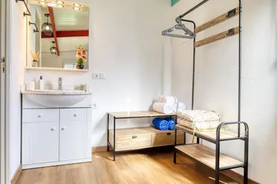 a bathroom with a sink and a mirror at O Miminho, a Home in Madeira in São Jorge