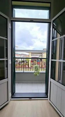 an open door to a balcony with a plant at In City - Funchal Heart with Rooftop in Funchal