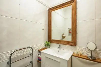 a bathroom with a sink and a mirror at Fairview Golfside Apartment at Boavista in Atalaia