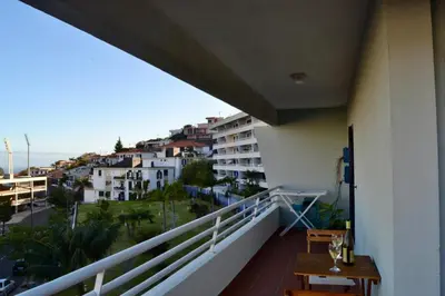 a balcony with a view of a building at Ocean View II in Funchal