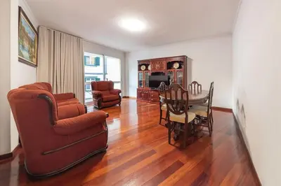 a living room with a table and a dining room at Esmael Apartment By Mth in Funchal