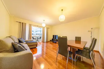 a living room with a couch and a table and chairs at Gorete Apartment 3 by Mth in Funchal