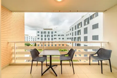 a table and chairs on a balcony with a view at Gorete Apartment 3 by Mth in Funchal
