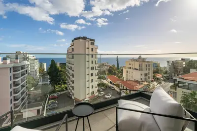 a balcony with a view of a city at Casa Branca Penthouse by An Island Apart in Funchal