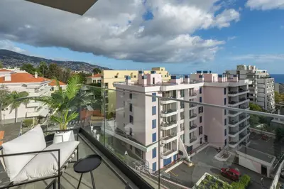 a balcony with a view of buildings at Casa Branca Penthouse by An Island Apart in Funchal