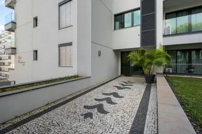 an external view of a white building with a courtyard at Casa Branca Penthouse by An Island Apart in Funchal