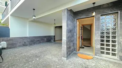 an empty room with a glass door in a building at Atlantic Breeze in Câmara de Lobos