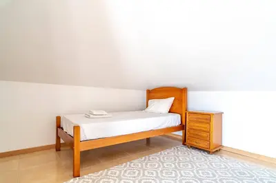 a balcony of a house with a view of the ocean at Camara De Lobos Lux Villa in Câmara de Lobos