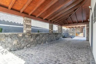 a living room with a couch and a coffee table at Camara De Lobos Lux Villa in Câmara de Lobos