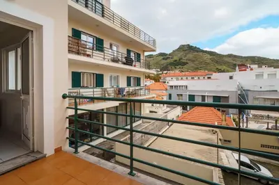 a balcony with a view of a building at GuestReady - Machico Apartment with Balcony in Machico