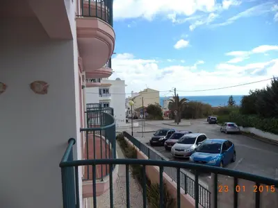 a walkway leading up to a house at St James Apartment in Luz