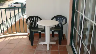 a balcony with a view of a parking lot at St James Apartment in Luz