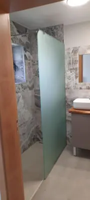 a bathroom with a shower and a sink at casa2sonhos in Água de Pena