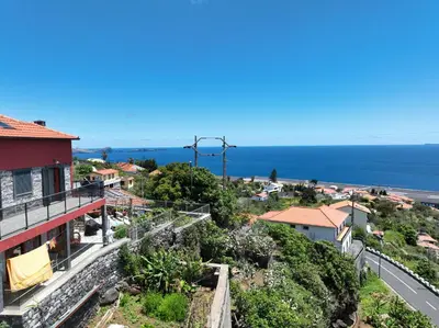 a view of the ocean from a house at casa2sonhos in Água de Pena