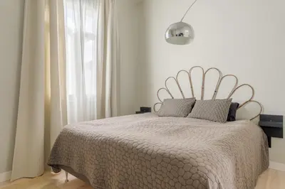 a white bedroom with a bed with a large window at Villa Lázaro By Holiday Rental Madeira in Funchal
