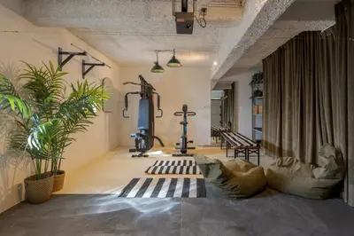 a room with a gym with plants and a treadmill at Villa Lázaro By Holiday Rental Madeira in Funchal