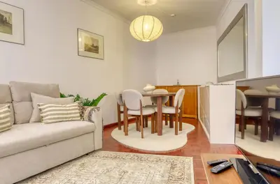 a living room with a couch and a table at Cantinho da Elvira, a Home in Madeira in Funchal