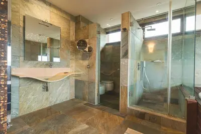 a bathroom with a sink and a shower at Casa Vista Azul by Atlantic Holiday in Santo da Serra