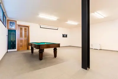 a room with a pool table in it at Casa Vista Azul by Atlantic Holiday in Santo da Serra