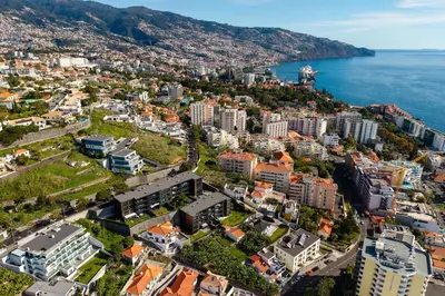an aerial view of a city next to the ocean at Villa Favila by Madeira Dream Stays in Funchal