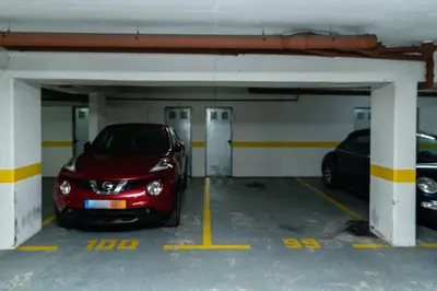 a red car parked in a parking garage at Atlantic View Nº3 in Caniço
