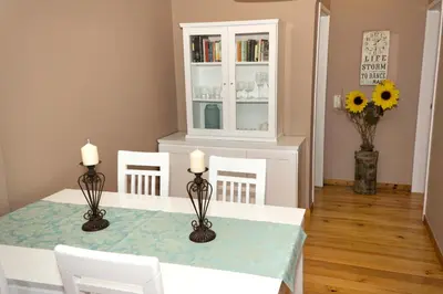 a dining room with a table and two candles at Atlantic Ocean by Holiday Rental Madeira in Funchal