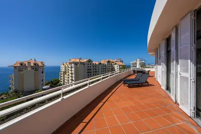 a balcony with two benches and the ocean at Diego Cruz Penthouse by Holiday Rental Madeira in Funchal