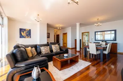 a living room with a couch and a table at Diego Cruz Penthouse by Holiday Rental Madeira in Funchal
