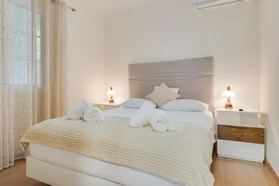 a bedroom with a bed with towels on it at Oasis do Norte by Holiday Rental Madeira in São Jorge