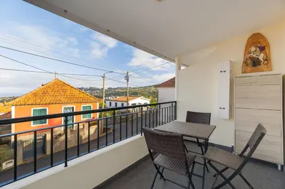 a balcony with a table and chairs and a view at Oasis do Norte by Holiday Rental Madeira in São Jorge