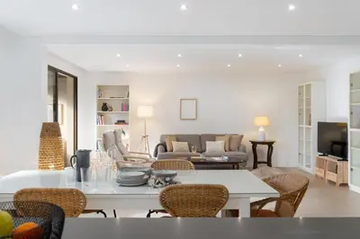 a living room with a table and chairs at Baía II by An Island Apart in Funchal