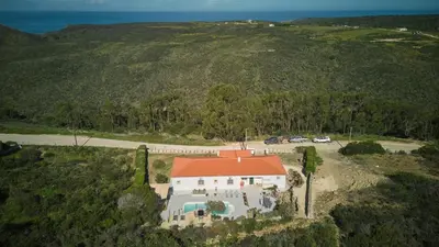 an aerial view of a house with an orange roof at Villa Hideaway - Splendid Sea View with a Pool in Aljezur