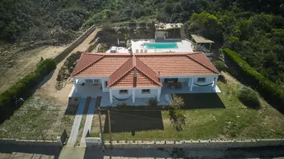 an aerial view of a house with a tile roof at Villa Hideaway - Splendid Sea View with a Pool in Aljezur