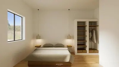 a white bedroom with a bed and a closet at Villa Hideaway - Splendid Sea View with a Pool in Aljezur