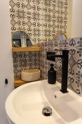 a bathroom with a sink and a mirror at tiny BEACH HOUSES - 2 min to Beach in Salema