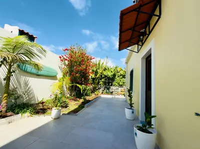a bathroom with a shower with a wall covered in plants at Levada Dreamscape - villa in Funchal