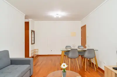 a living room with a couch and a table at New Santa Cruz Airport & Downtown Apartment in Santa Cruz