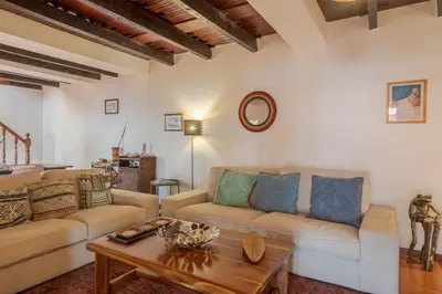 a living room with a couch and a table at Villa Flora by Holiday Rental Madeira in Estreito da Calheta