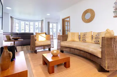 a living room with a couch and chairs and a table at Villa Machico Valley Flat 2 in Machico
