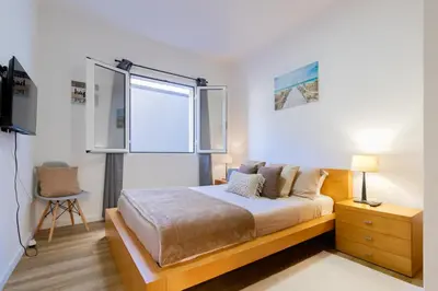 a bedroom with a bed and a window at Villa Machico Valley Flat 2 in Machico